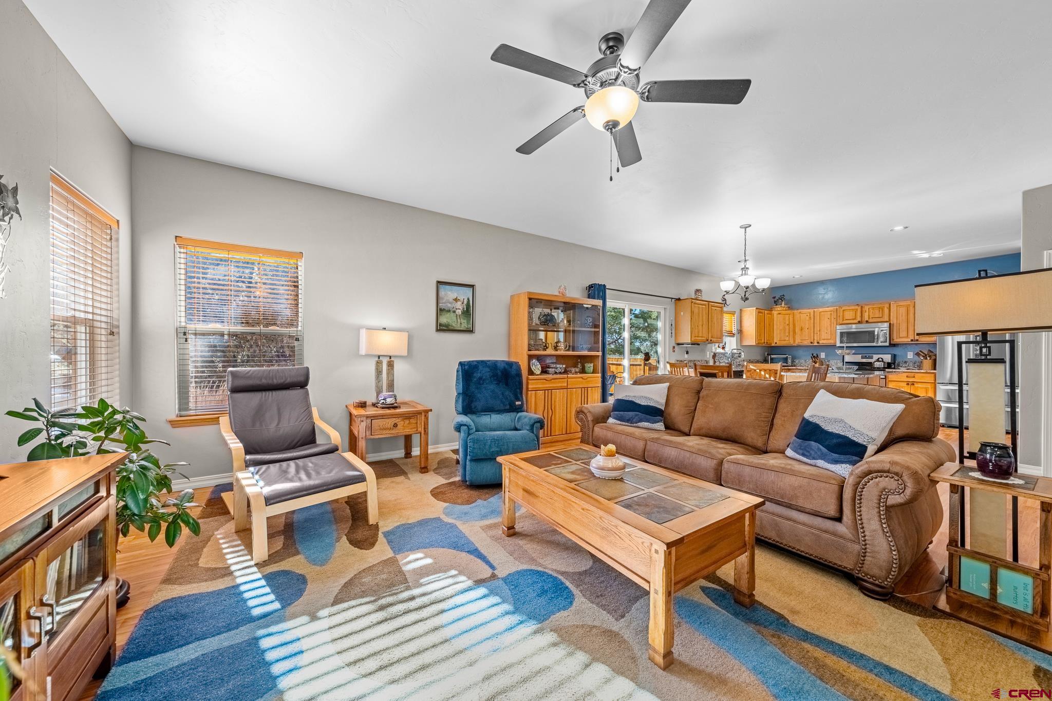 72 Cedar Ridge Way Durango, CO 81301 - Photo 3 of 33 a living room with furniture and a wooden floor