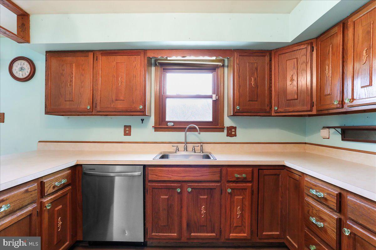 4045 North Stone Road Taneytown, MD 21787 - Photo 11 of 45 a kitchen with granite countertop cabinets sink and window