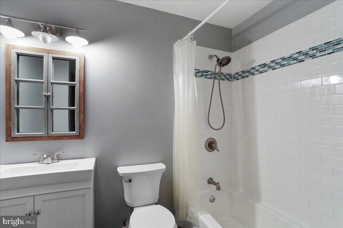 4045 North Stone Road Taneytown, MD 21787 - Photo 13 of 45 a bathroom with a granite countertop sink toilet and shower