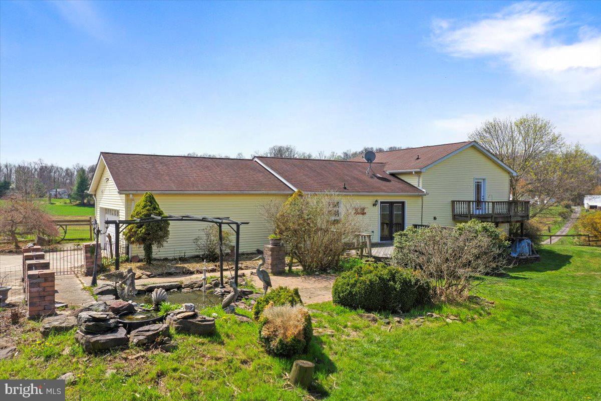 4045 North Stone Road Taneytown, MD 21787 - Photo 29 of 45 a view of house with outdoor seating and green space