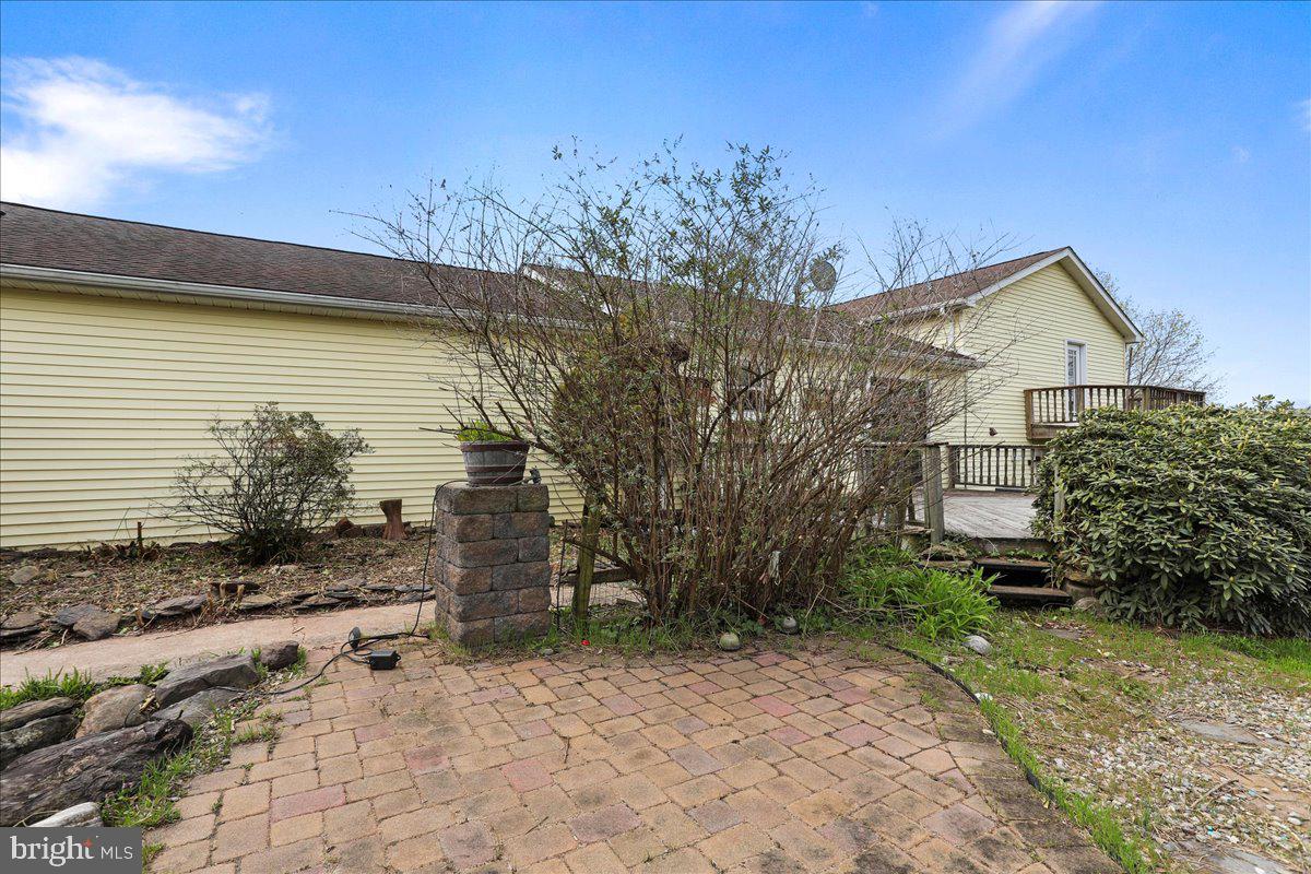 4045 North Stone Road Taneytown, MD 21787 - Photo 34 of 45 a view of a backyard with plants and large tree