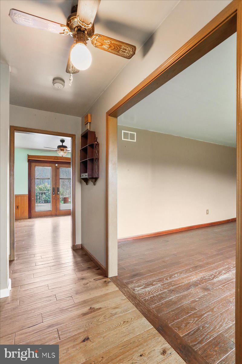 4045 North Stone Road Taneytown, MD 21787 - Photo 5 of 45 a view of a livingroom with a ceiling fan