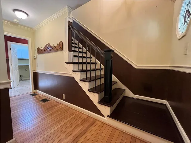 a kitchen with stainless steel appliances granite countertop a refrigerator and a stove