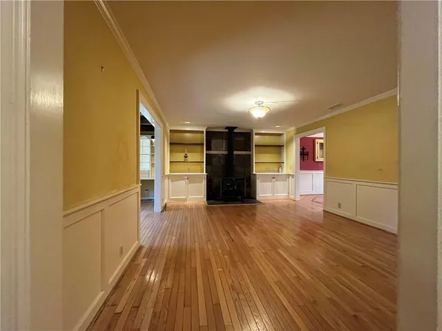 a stove top oven sitting inside of a kitchen