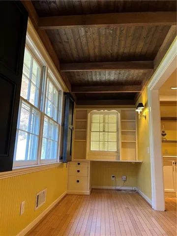 a room with a sink and a mirror