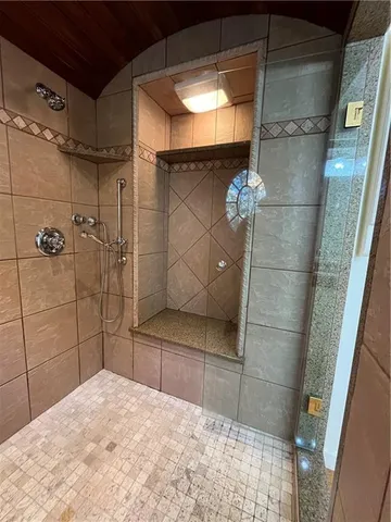 a view of a lake with houses in the back