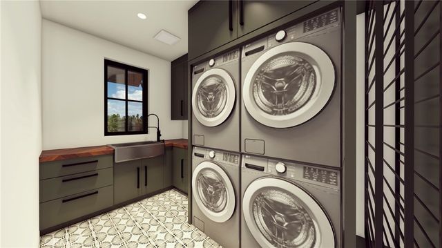 a kitchen with stainless steel appliances kitchen island granite countertop a refrigerator and a stove