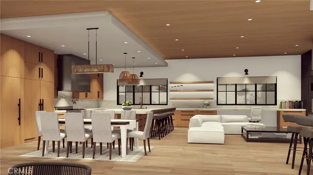 a living room with lots of furniture and kitchen view