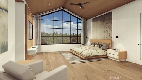 a spacious bedroom with a large bed and a window