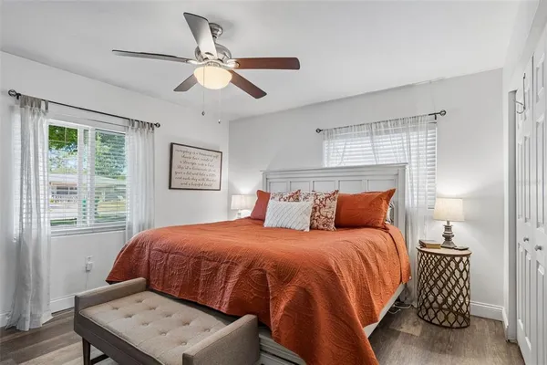 a bedroom with a bed and a window