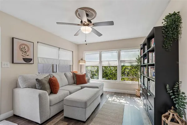 a living room with furniture and a large window