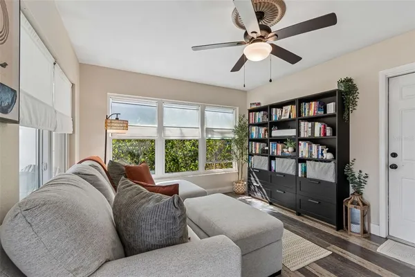 a living room with furniture and a window