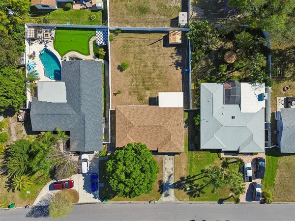 an aerial view of houses with outdoor space