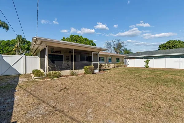 a view of house with backyard and outdoor space