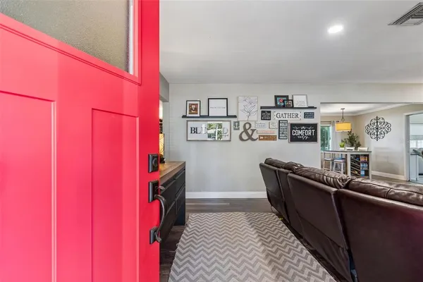 a living room with furniture and a rug