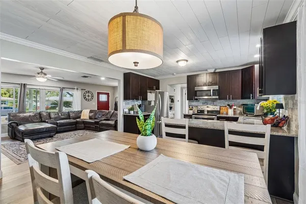 a kitchen with a table and chairs in it