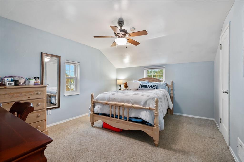 5300 Spring Valley Drive Pittsburgh, PA 15236 - Photo 14 of 25 a bedroom with a bed and a chandelier