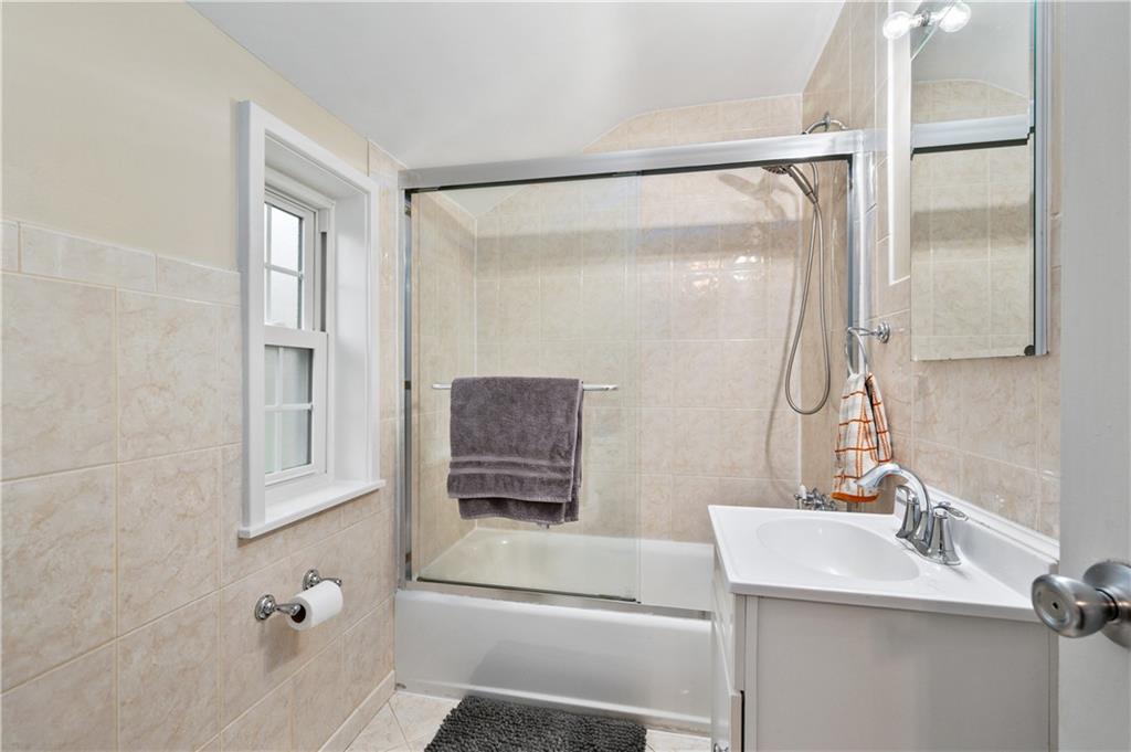 5300 Spring Valley Drive Pittsburgh, PA 15236 - Photo 16 of 25 a bathroom with a sink and a mirror