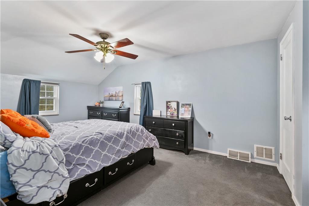 5300 Spring Valley Drive Pittsburgh, PA 15236 - Photo 17 of 25 a bedroom with a bed and dresser