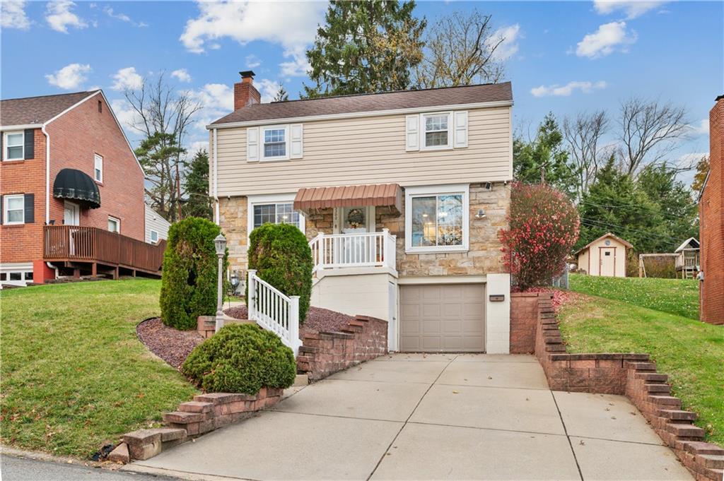 5300 Spring Valley Drive Pittsburgh, PA 15236 - Photo 2 of 25 a front view of a house with a garden