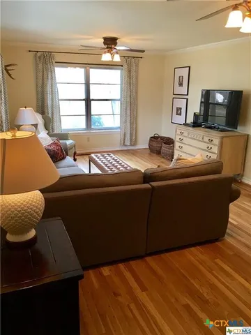 a living room with furniture and window