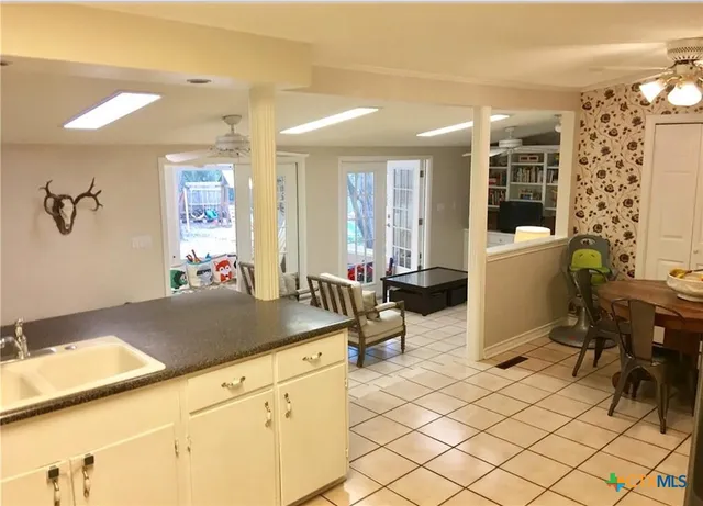 a room with gym equipment and large window