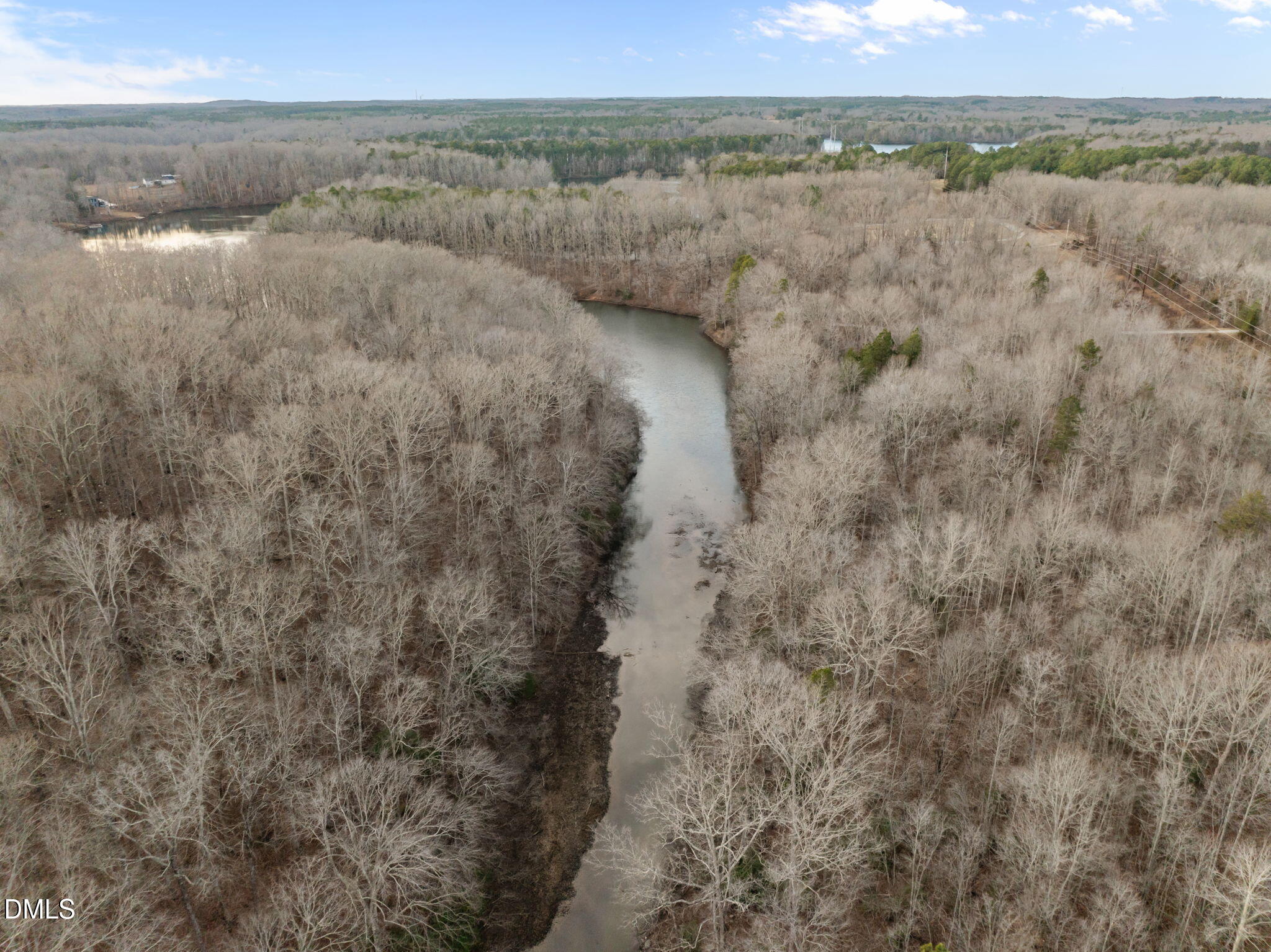 10.75-acre Neal's Store Road Roxboro, NC 27574 - Photo 1 of 17 a view of a lake in middle of a field