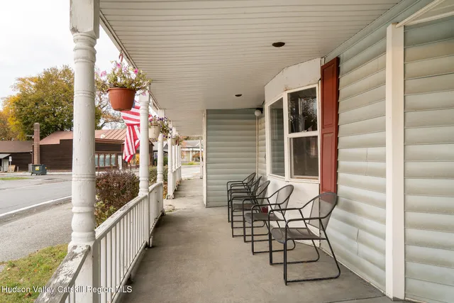 a view of balcony with furniture