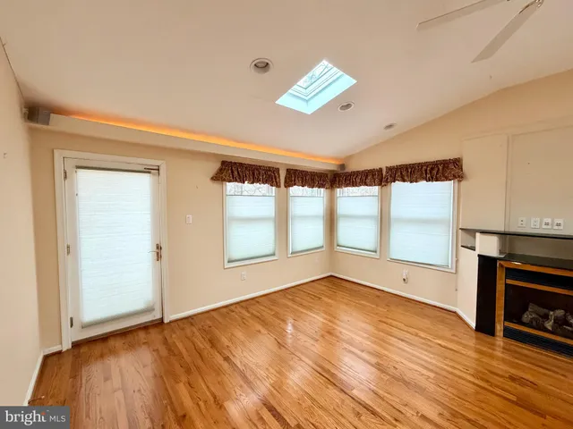 a kitchen with kitchen island a sink a counter and a refrigerator