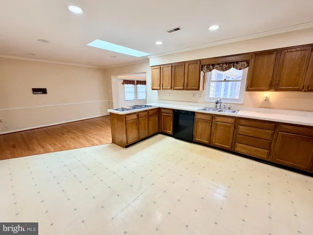 a view of living room with wooden floor and fireplace