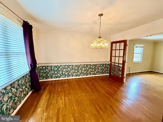 a utility room with a wooden floor