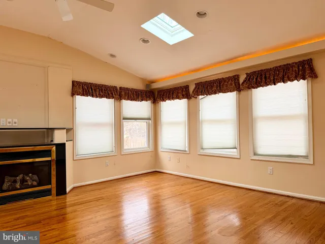 a kitchen with stainless steel appliances a sink a stove a refrigerator cabinets and a counter top space