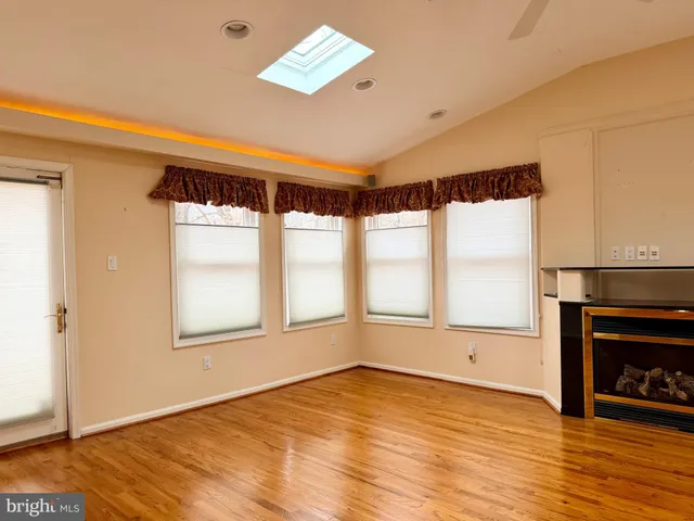 a kitchen with stainless steel appliances granite countertop a refrigerator and a stove
