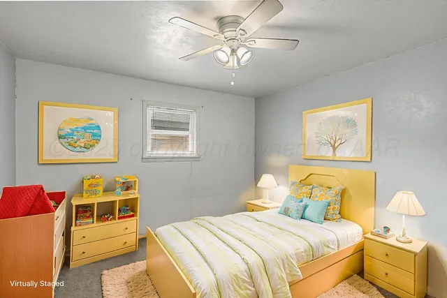 a en suite bathroom with a granite countertop sink and a mirror