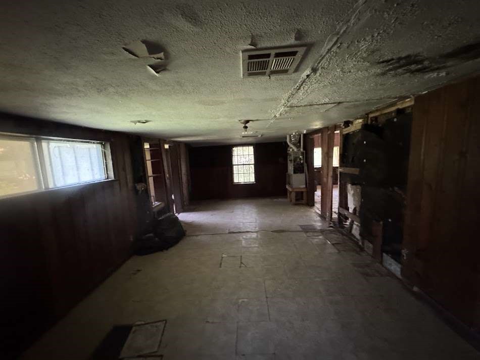 416 Live Oak Loop Whitney, TX 76692 - Photo 3 of 13 a view of a hallway with wooden floor and windows