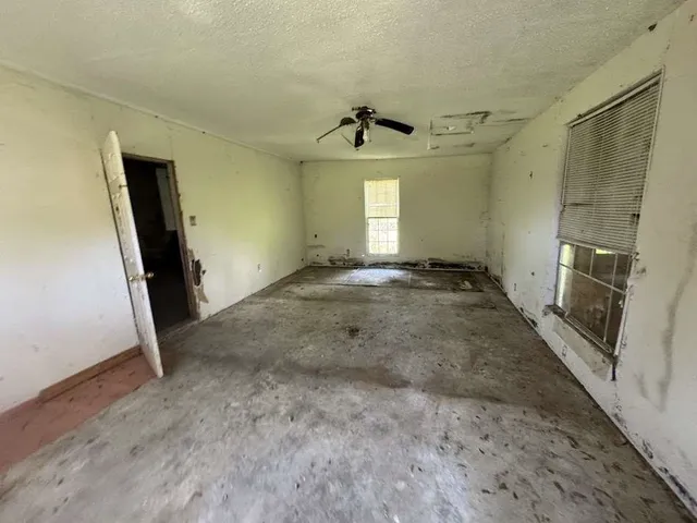 an empty room with windows