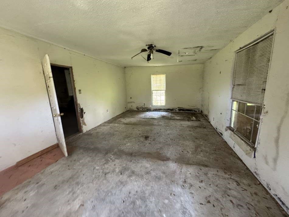 416 Live Oak Loop Whitney, TX 76692 - Photo 8 of 13 an empty room with windows