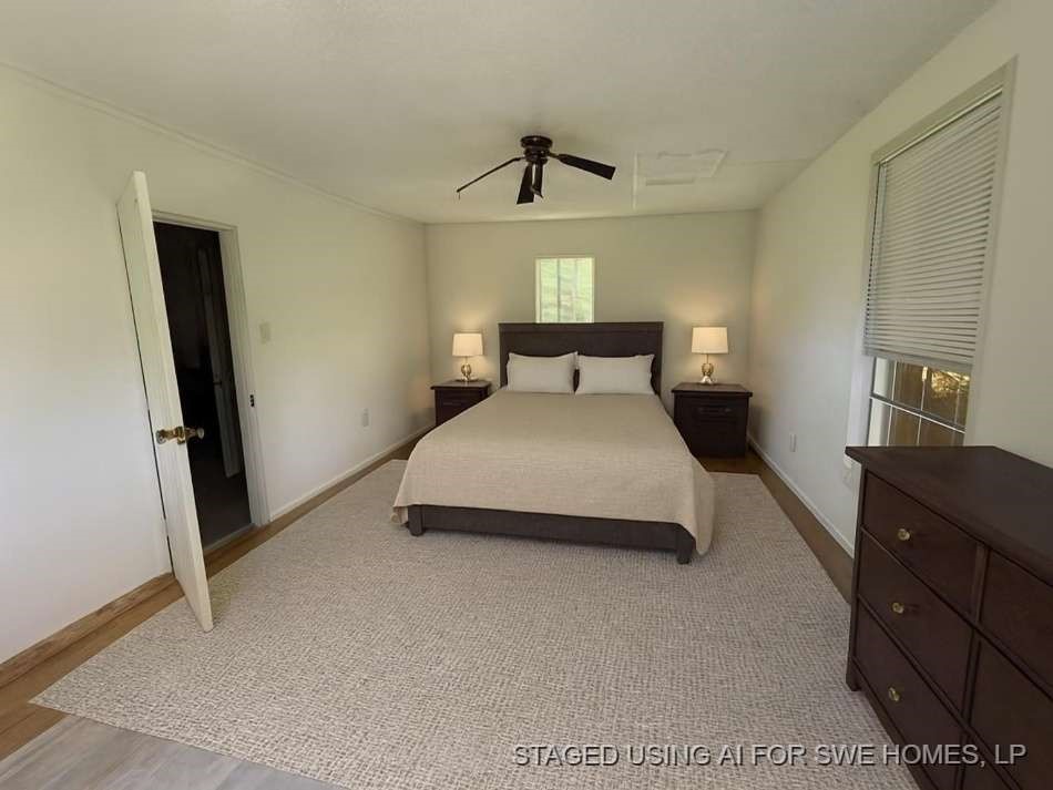 416 Live Oak Loop Whitney, TX 76692 - Photo 9 of 13 a bedroom with a bed and a dresser