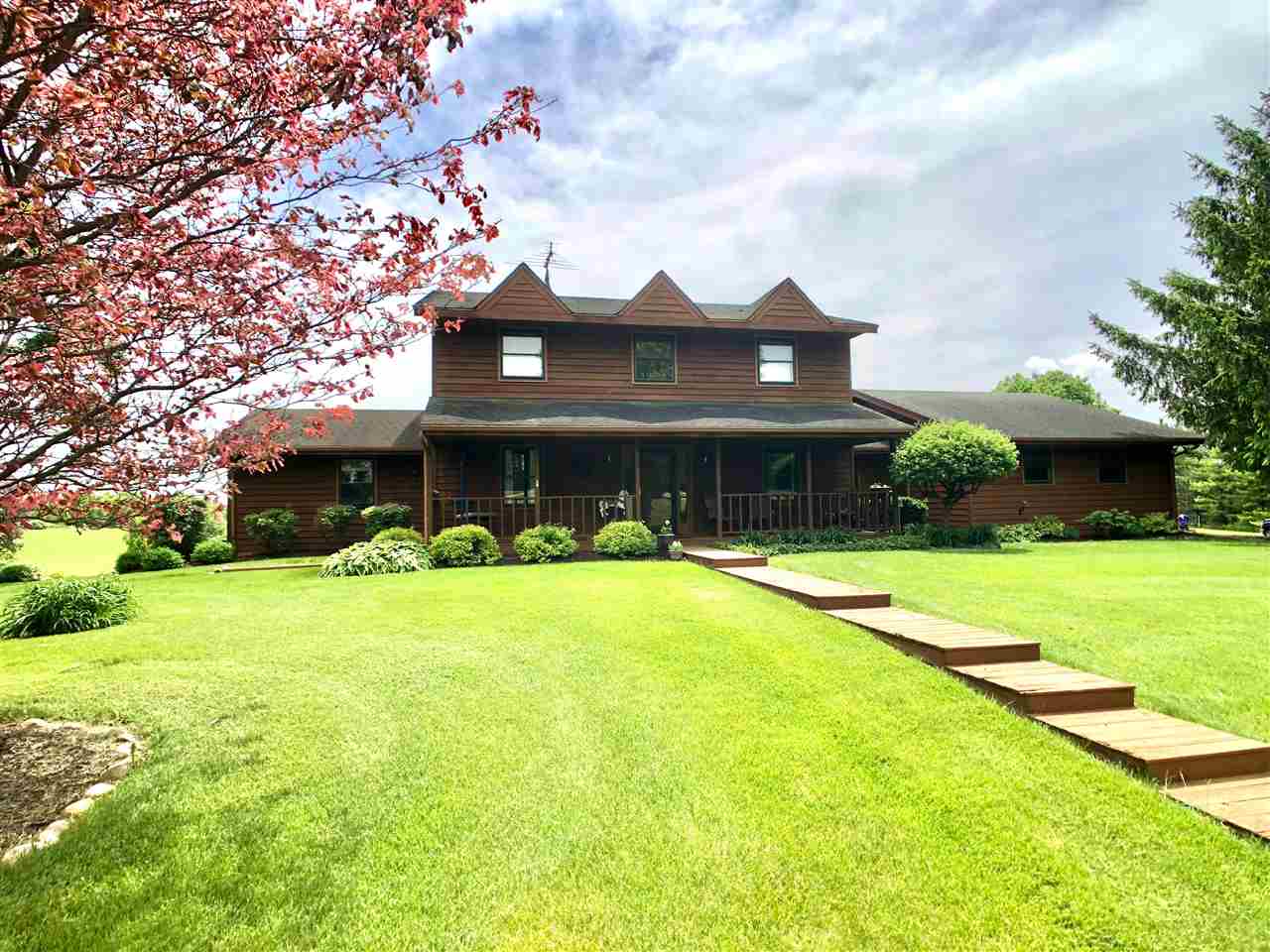 a front view of a house with a yard