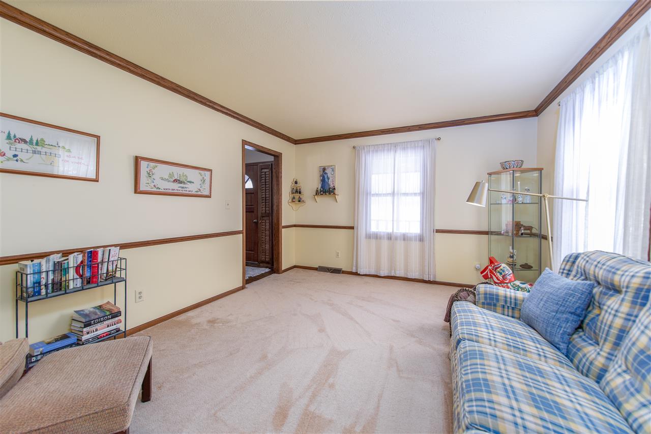 7339 East Wildwood Road Stillman Valley, IL 61084 - Photo 18 of 40 a living room with furniture and a window