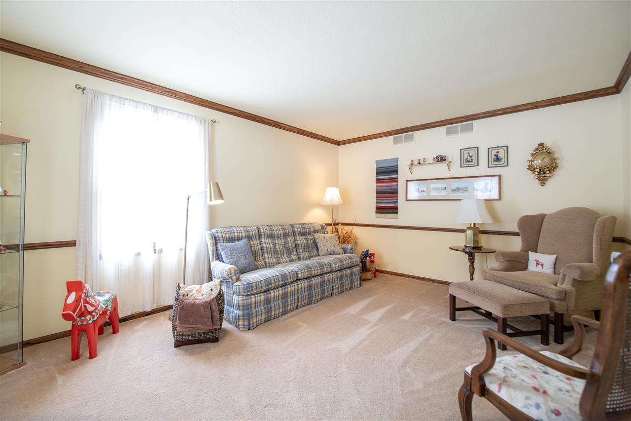 7339 East Wildwood Road Stillman Valley, IL 61084 - Photo 19 of 40 a living room with furniture and a window