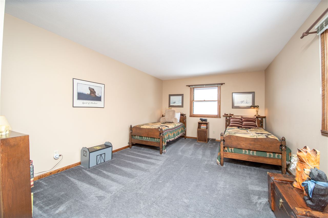 7339 East Wildwood Road Stillman Valley, IL 61084 - Photo 30 of 40 a bedroom with furniture and a window