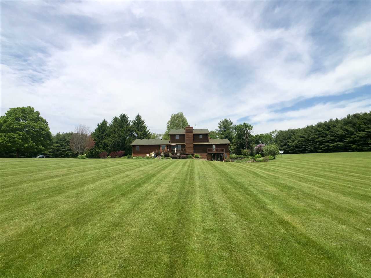 7339 East Wildwood Road Stillman Valley, IL 61084 - Photo 6 of 40 a view of a big yard with a large trees