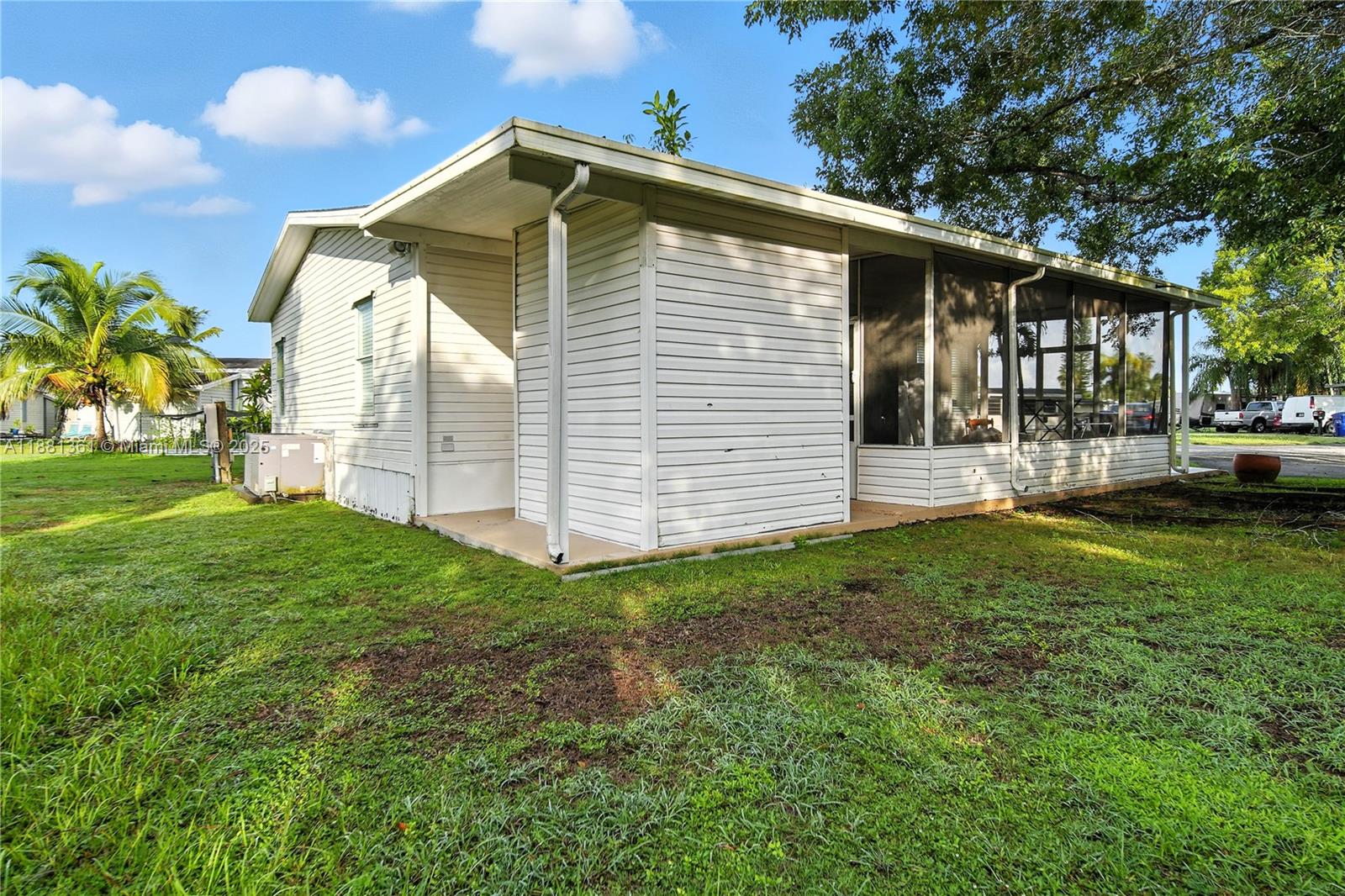 18728 Southwest 349th Street, Unit 442 Homestead, FL 33034 - Photo 11 of 15 a front view of house with yard and green space