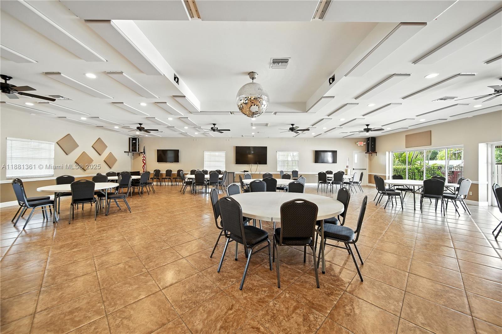18728 Southwest 349th Street, Unit 442 Homestead, FL 33034 - Photo 15 of 15 a living room with lots of furniture and a clock