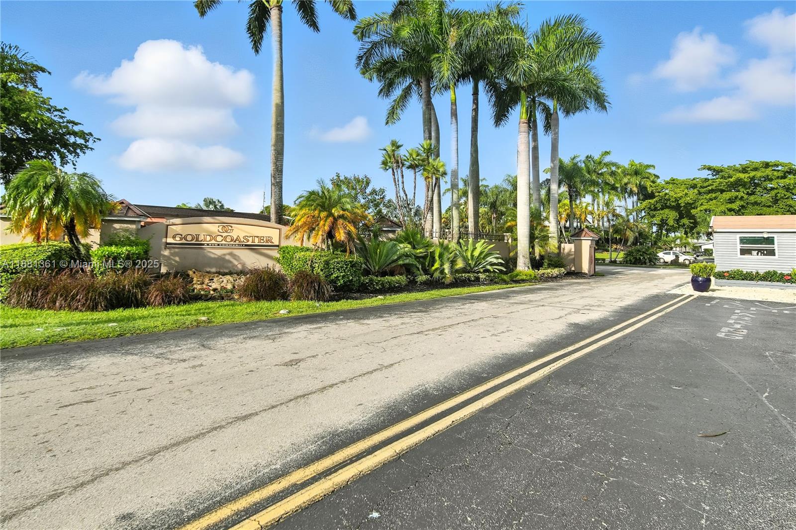 18728 Southwest 349th Street, Unit 442 Homestead, FL 33034 - Photo 3 of 15 a view of a street with palm trees