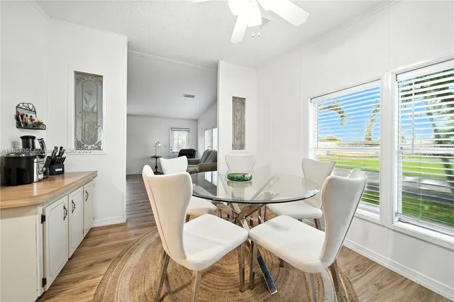 a view of a dining room with furniture window and outside view