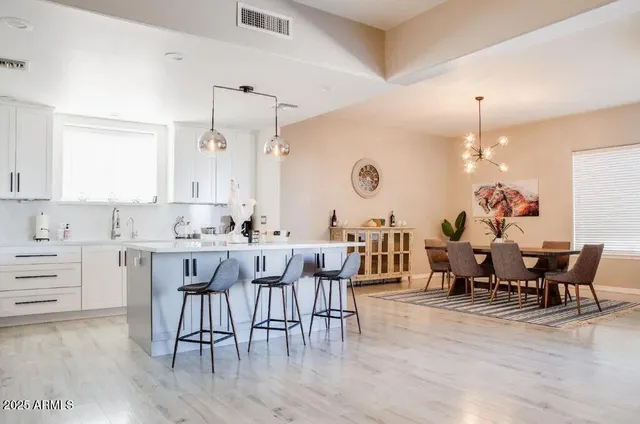 a kitchen with a sink cabinets and window