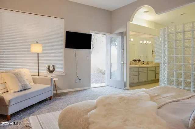 a bathroom with double sink and a mirror