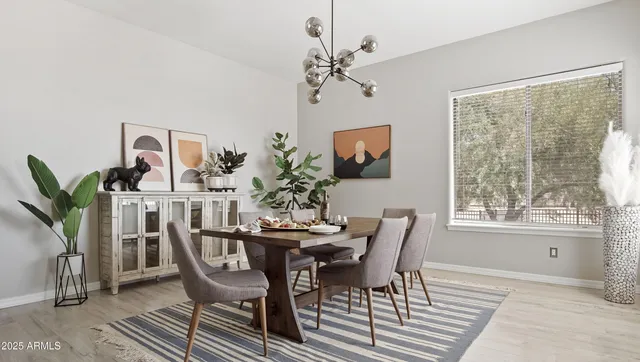 a dining room with furniture and window